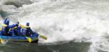 rafters paddling through whitewater